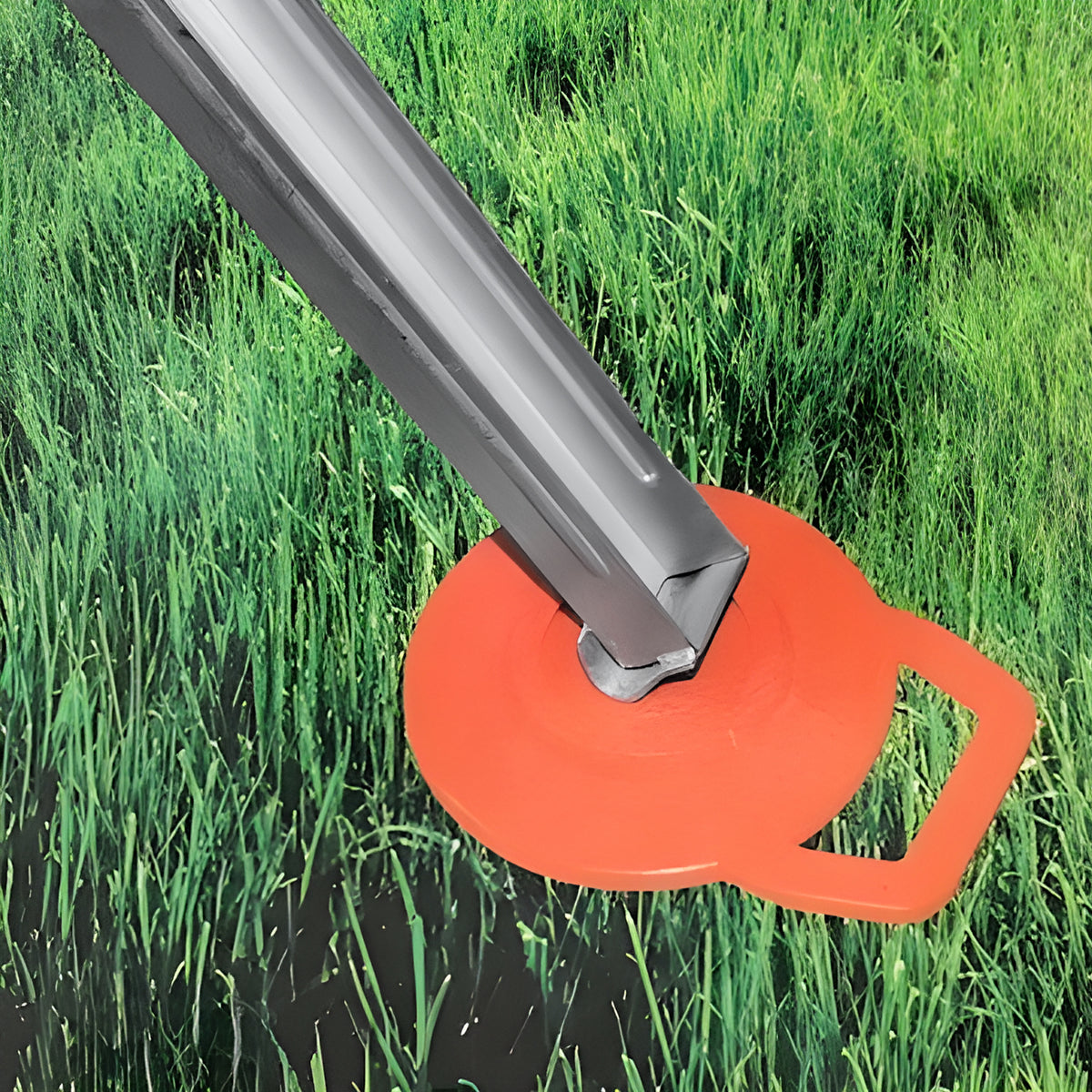 On The Road RV jack pad under a caravan stabiliser leg on grass, close-up