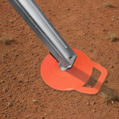 On The Road RV jack pad under a caravan stabiliser leg on red outback dirt